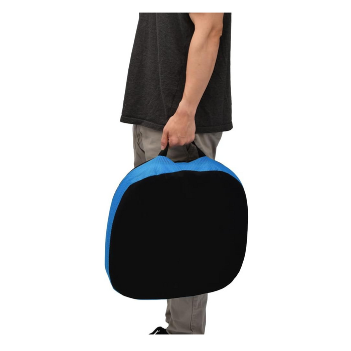 A person in a dark shirt and light pants easily carries a Nova Medical Happy Collection Back and Lumbar Support Gel Cushion, featuring a convenient handle on the left, against a white background.