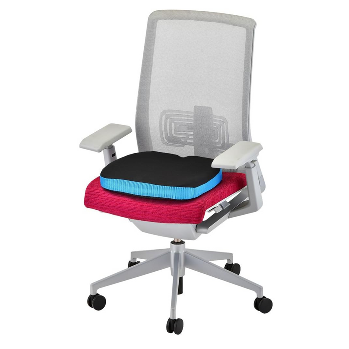 The ergonomically designed Nova Medical Happy Collection office chair features a grey mesh backrest, pink cushioned seat, lumbar support, and a black pressure relief cushion with a blue edge. It includes adjustable white armrests and a five-star wheeled base for easy mobility.
