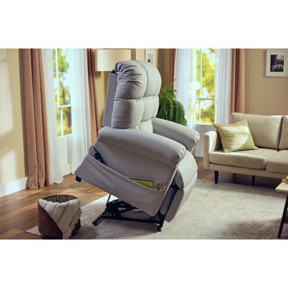The Journey Perfect Sleep Reclining Lift Chair with Heat brings ultimate comfort to your living room with its therapeutic heat and massage features. Nestled on wooden floors, it complements white and beige curtains, a sofa with a throw pillow, and a basket with a blanket as greenery thrives outside the windows.