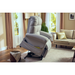 A Journey Perfect Sleep Recliner & Lift Chair with Heat, featuring therapeutic massage, is partially elevated in a cozy living room with a sofa, beige curtains, and large windows. Nearby, a small basket with a blanket enhances the inviting atmosphere.