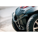 Close-up of the front bumper and tires on the Pride Baja® Raptor® 2 Bariatric 4-Wheel Scooter, showing the textured surface, curved metal guard, and detailed rim—crafted for outdoor mobility with premium comfort.