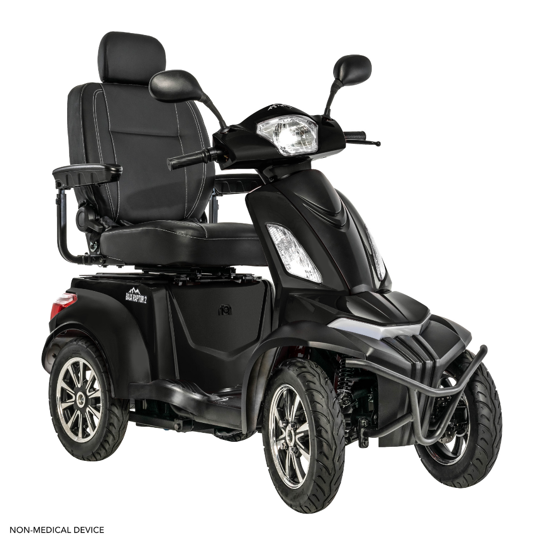 The Pride Baja® Raptor® 2 Bariatric 4-Wheel Scooter in black features a padded seat, armrests, backrest, handlebars, headlights, and large tires for outdoor mobility. “NON-MEDICAL DEVICE” label shown in the corner on a white background.