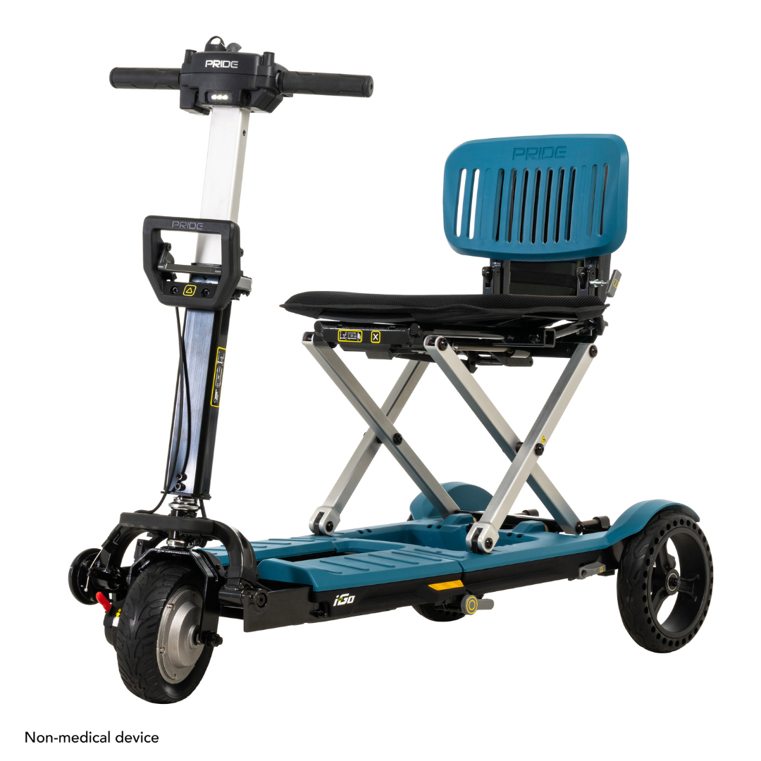 The Pride Mobility i-Go™ Portable Travel Scooter features a sleek black frame, teal seat, four wheels, simple handlebars, and an ultra-compact design. Its Feather-Touch Disassembly ensures easy transport and storage.