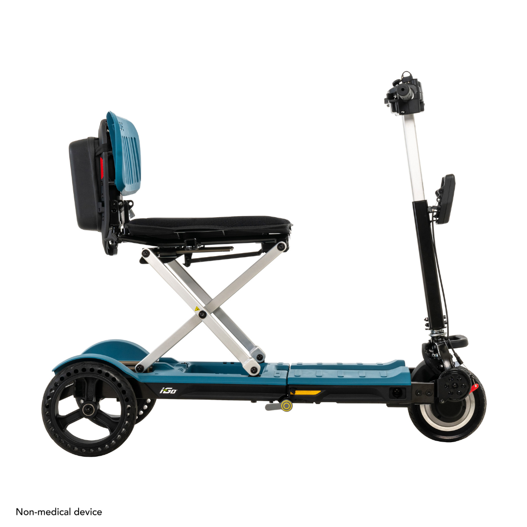 Introducing the Pride Mobility i-Go™ Portable Travel Scooter, a foldable, non-medical electric ride with an Ultra-Compact Profile. It features a teal frame with black accents, a seat, three wheels, handlebars, and Feather-Touch Disassembly for easy storage.