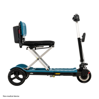 Introducing the Pride Mobility i-Go™ Portable Travel Scooter, a foldable, non-medical electric ride with an Ultra-Compact Profile. It features a teal frame with black accents, a seat, three wheels, handlebars, and Feather-Touch Disassembly for easy storage.