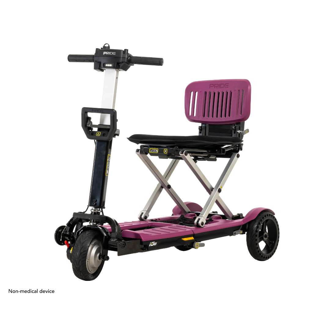 Introducing the Pride Mobility i-Go™ Portable Travel Scooter, an ultra-compact marvel with a purple seat and base. This three-wheel wonder features Feather-Touch Disassembly, collapsible design, intuitive handlebars with controls, and is labeled as a Non-medical device.