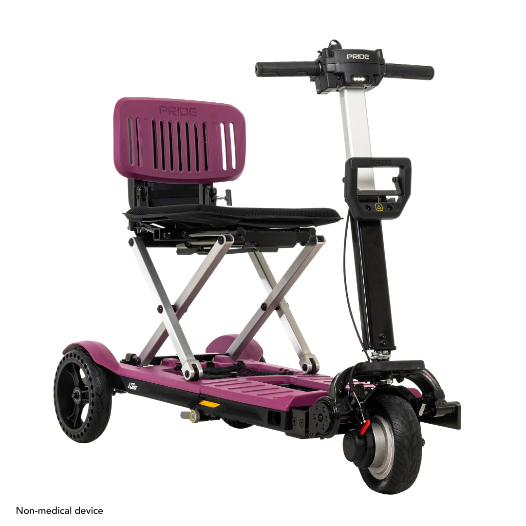 The Pride Mobility i-Go™ Portable Travel Scooter features a vibrant purple frame, sleek black seat, three wheels, and a handlebar. Its ultra-compact design ensures easy storage and transport, while Feather-Touch Disassembly allows for quick setup, enhancing mobility.