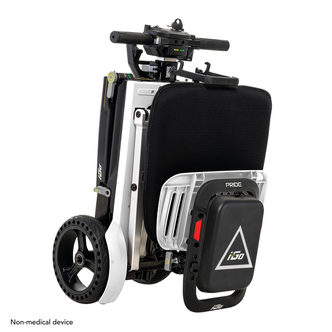 The Pride Mobility i-Go™ Portable Travel Scooter is a compact, foldable electric scooter with a black seat cushion and robust wheels. It features a modern design with a rear battery pack and is noted for convenience as a non-medical device.