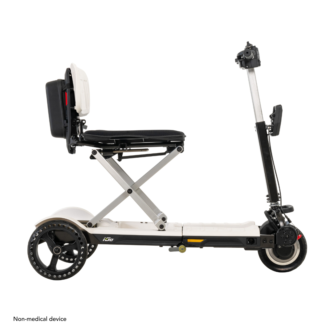The Pride Mobility i-Go™ Portable Travel Scooter features a compact, foldable design with a cushioned seat, backrest, and three wheels. Its sleek black and white appearance ensures style while being classified as a non-medical device.