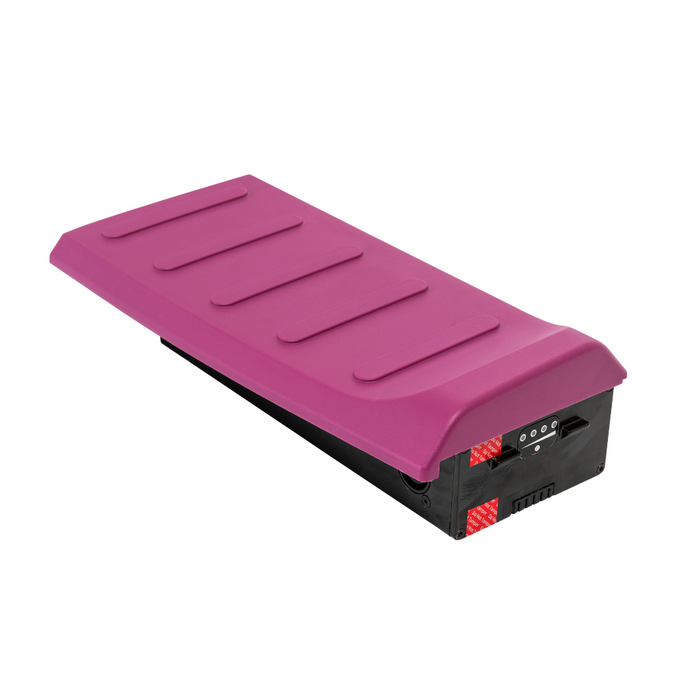 A purple rectangular electronic device with a textured top and side ports, featuring red accents and sleek grooves for a modern design, has an ultra-compact profile reminiscent of innovations like the Pride Mobility i-Go™ Portable Travel Scooter, enhancing convenience.