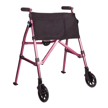 The Stander Bariatric Wonder Walker Plus with Wheels is a lightweight, compact pink folding walker featuring black handles, four wheels, and a front-attached black storage pouch for convenient mobility.