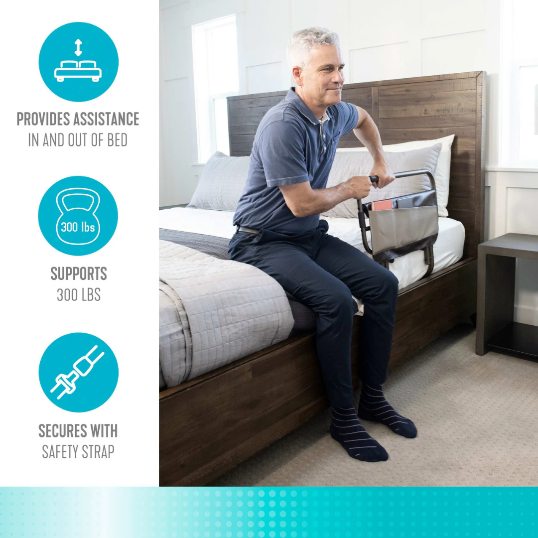 A man sits on a bed holding the Signature Life Sleep Safe Extendable Bed Rail, which supports up to 300 lbs, has a safety strap, and aids getting in or out of bed. Specs and warranty info offer added confidence.