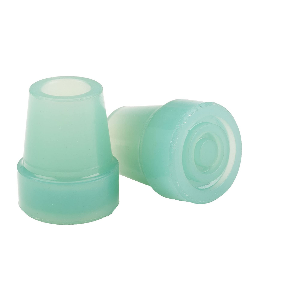 Two translucent, teal-green rubber caps—one upright, one on its side—designed as protective end covers for the Step2bed Deluxe Bedside Step-Up Platform with Accessory kit.