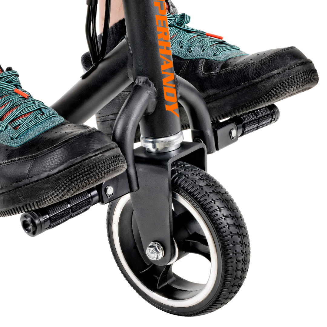 Close-up of a person in black sneakers with teal accents on a SuperHandy Passport Power Mobility 3-Wheel Scooter, weighing only 35 lbs. The black scooter features small black front wheels and highlights its sleek, practical design with SUPERHANDY adorning the foldable frame.