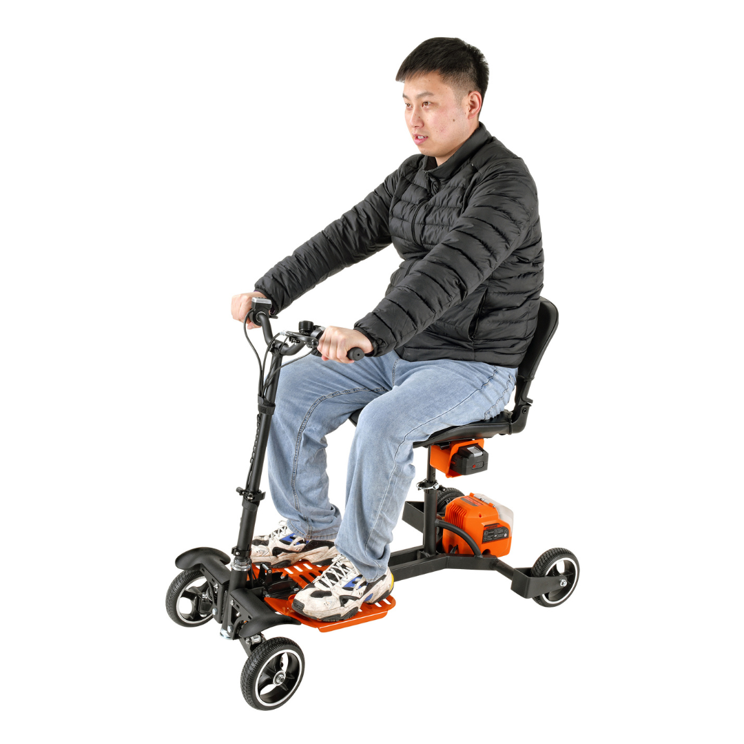 A person in a black jacket and blue jeans rides a SuperHandy Passport Pro Mobility Scooter. This foldable, ultralite, orange and black scooter is ideal for personal transportation with its three wheels and comfortable seat.