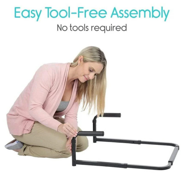 A person in a pink cardigan kneels on the floor assembling the Vive Health Couch Stand Assist, an adjustable aluminum frame. Text above reads, Easy Tool-Free Assembly, No tools required.