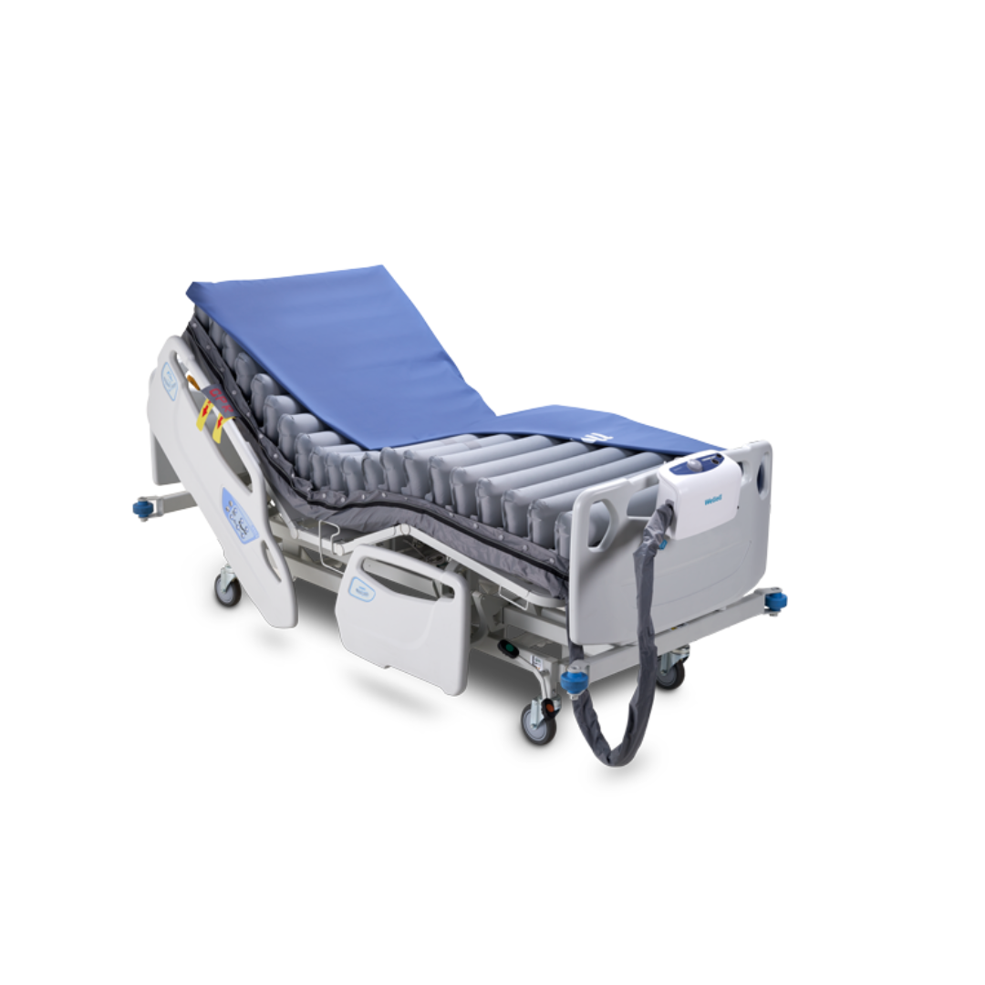 The Wellell Domus 3 Bariatric Alternating Pressure Mattress with Micro Low Air Loss features adjustable blue air cells, side rails, electronic controls, and an air pump for effective pressure ulcer prevention in long-term care settings.