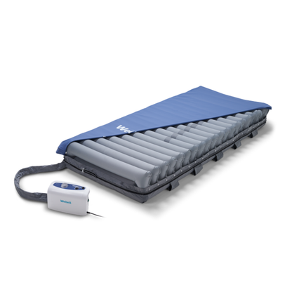 The Wellell Domus 3 Bariatric Alternating Pressure Mattress with Micro Low Air Loss features advanced pressure redistribution and a blue cover to enhance comfort and help prevent pressure ulcers for bedridden patients in long-term care.